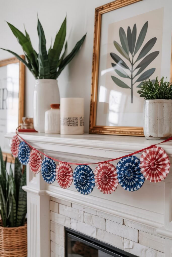 DIY 4th of July Decor: Best Patriotic Crafts for Apartments & Homes 5 Mantel decorated with miniature red and blue paper rosettes garland and neutral modern decor for subtle 4th of July charm.
