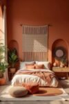Burnt Orange Bedroom Color Combinations: The Best Shades to Pair for a Stylish Retreat Cozy burnt orange boho bedroom with macramé wall hanging, layered pillows, and natural wood accents