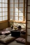 Cozy Japanese Breakfast Nook with low table, tea set, and cushions by shoji screens in soft sunlight.