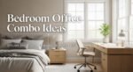 Bright, neutral-toned bedroom with a large window, upholstered bed, and spacious wooden desk featuring a lamp, plant, and chair, illustrating a stylish small bedroom office combo idea.