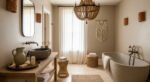 Fresh Ways to Layer Boho Bathroom Decor Neutral-toned bathroom with a stone soaking tub, vessel sink, wood vanity, woven chandelier, and macrame wall hanging for boho bathroom decor.