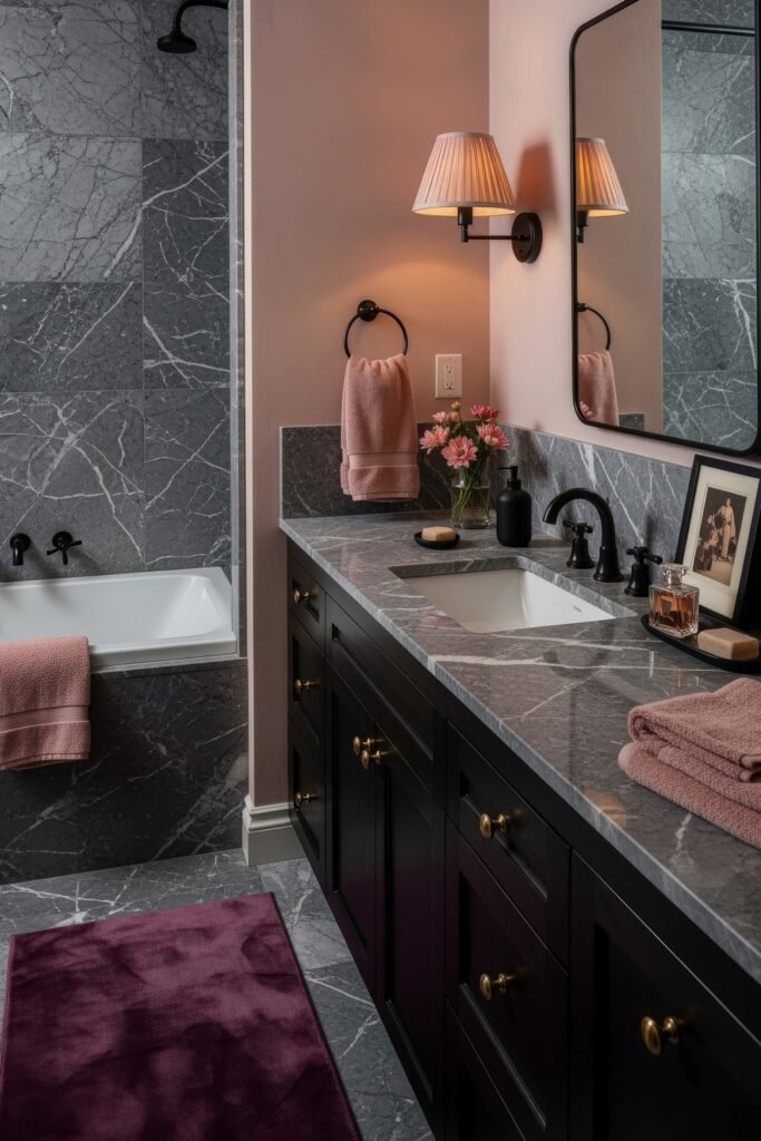 Fresh Ways to Style Pink Bathroom Decor: Looks That Glow 5 Chic bathroom with black cabinetry, gray marble, and blush pink walls, accented with flowers, soft towels, and subtle pink bathroom decor.