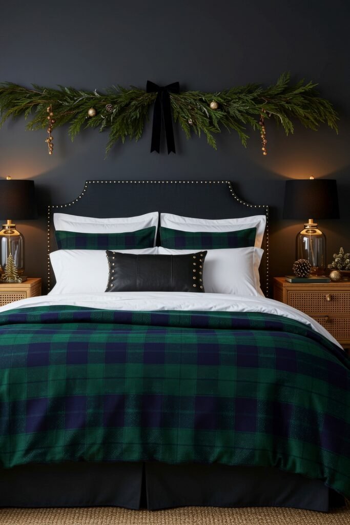 Elevate Your Bedroom with Cozy Christmas Bedding 13 Dark bedroom with green and navy plaid bedding, black leather accent pillow, and glowing garland above the headboard with ornaments and a black bow.