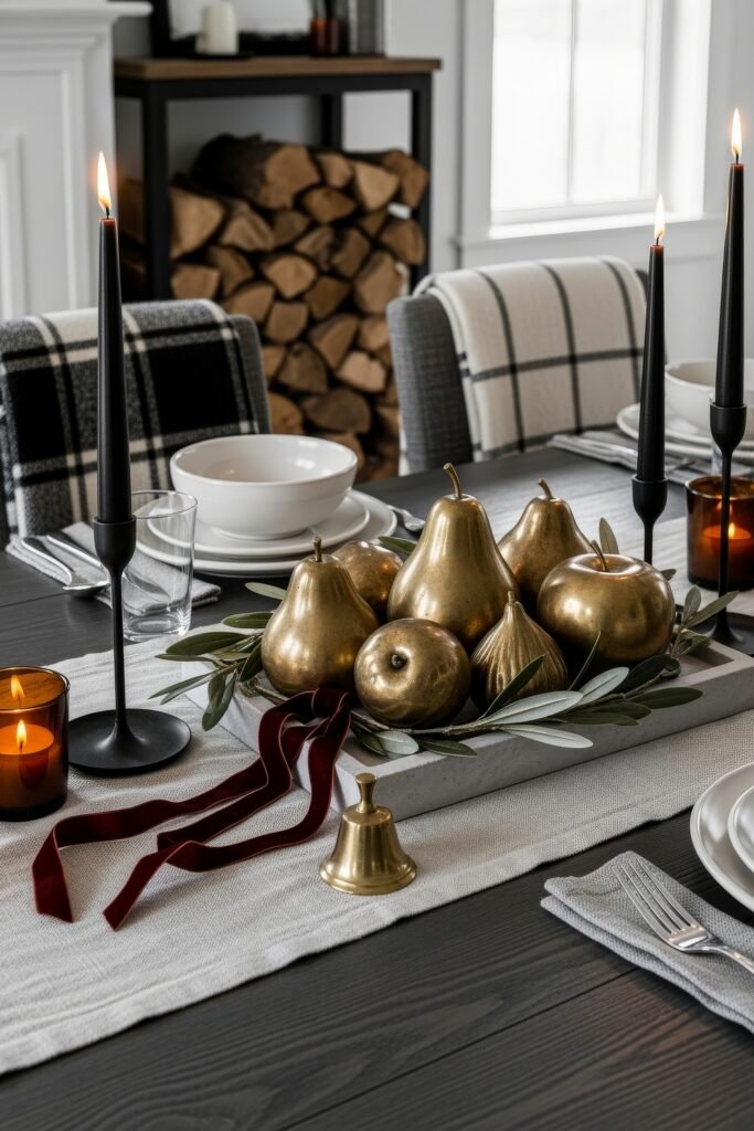 Modern, Cozy Ideas for Fall Thanksgiving Décor 16 A dramatic dining table centerpiece with golden pears and apples, black candles, and velvet ribbon accents for a bold fall Thanksgiving décor.