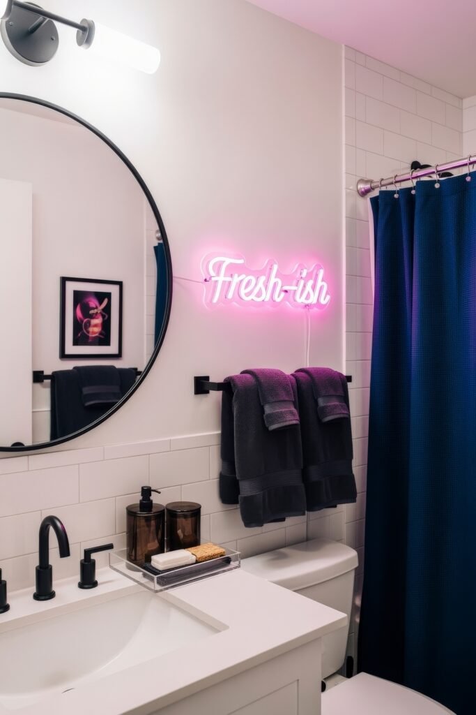 Small Changes, Big Smiles with funny bathroom decor 19 Modern bathroom decor with moody tones, a neon “fresh-ish” sign, and navy accents giving the space a witty funny bathroom decor statement.