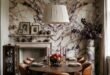 Calacatta Viola Marble Ideas for Elevated Interiors 165 Elegant dining room with a round wood table and leather chairs beneath a large pendant against a dramatic bookmatched marble wall