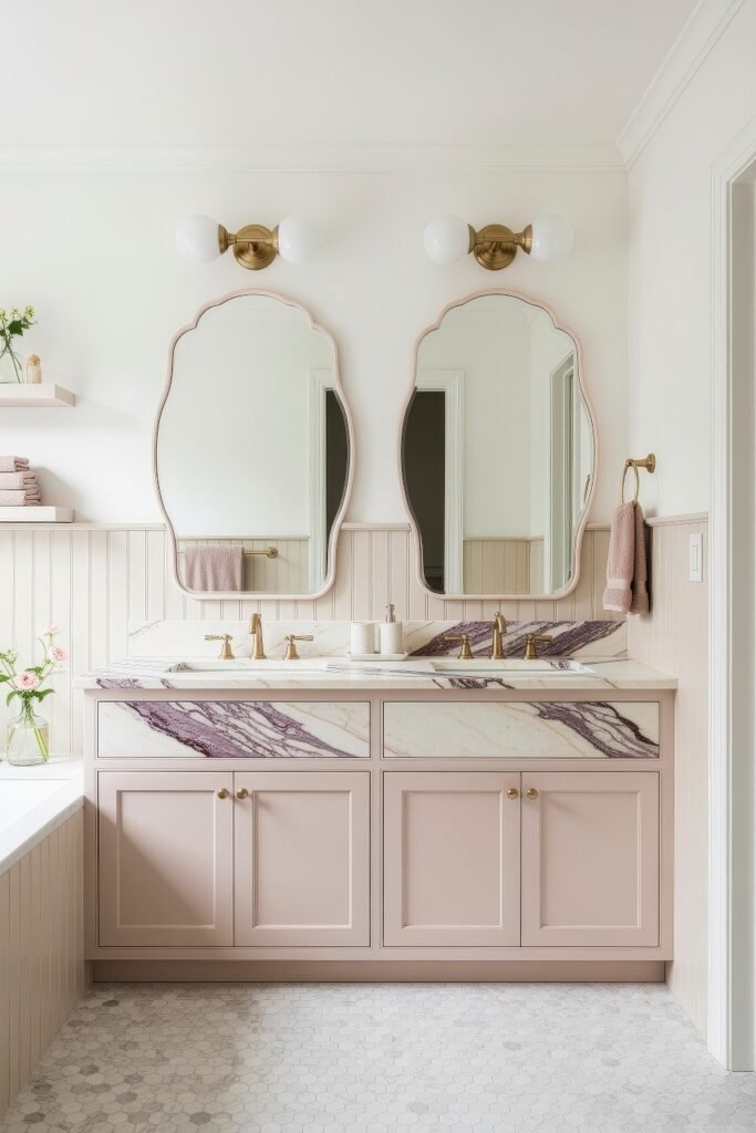 Calacatta Viola Bathroom Ideas for a Richer Look 21 Soft pink bathroom with double vanity Calacatta Viola marble countertop and scalloped mirrors beneath brass globe sconces