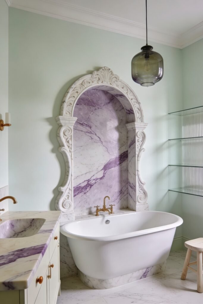 Calacatta Viola Bathroom Ideas for a Richer Look 5 Mint green bathroom with freestanding tub framed by an ornate Calacatta Viola marble arch and glass shelves with brass fixtures