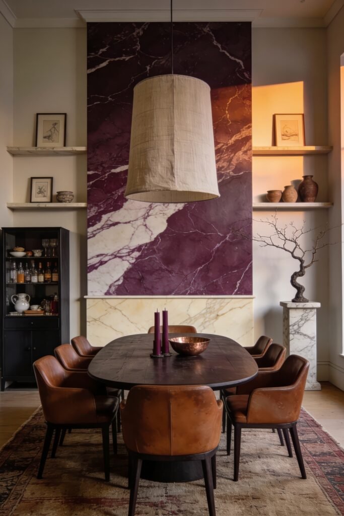 Moody dining room with leather chairs and a dark wood table beneath a pendant against a tall purple marble accent wall